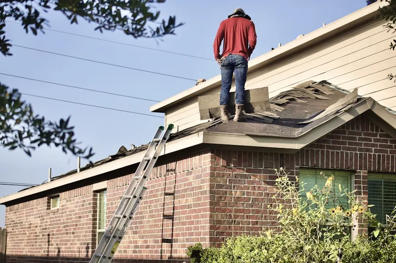 Professional roofer working on a residential roof in Huntington Harbour
